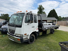 2006 UD 2000 Rollback — Fleet Retirement